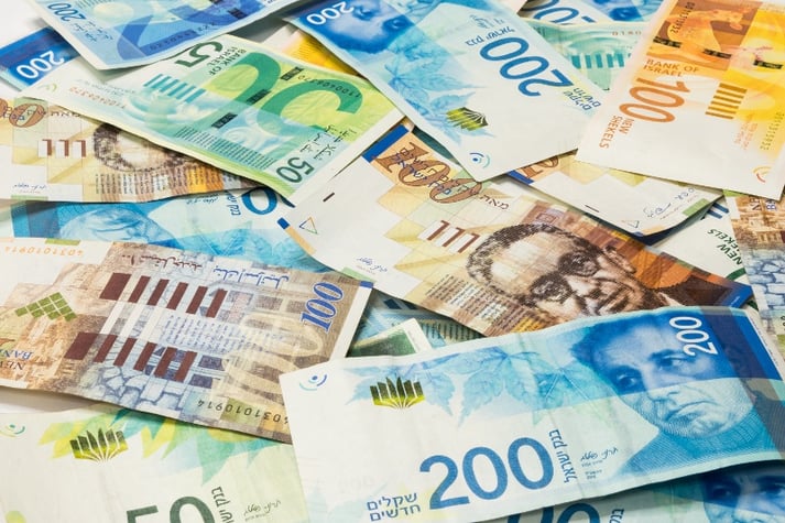 Israeli money stack of new Israeli banknotes of different colors and denominations 