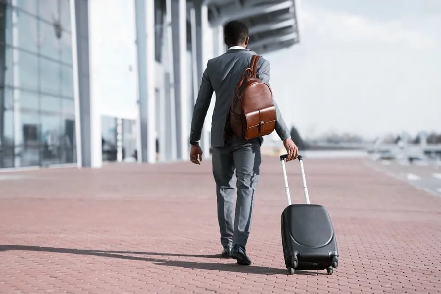 Man Walking with Suitcase