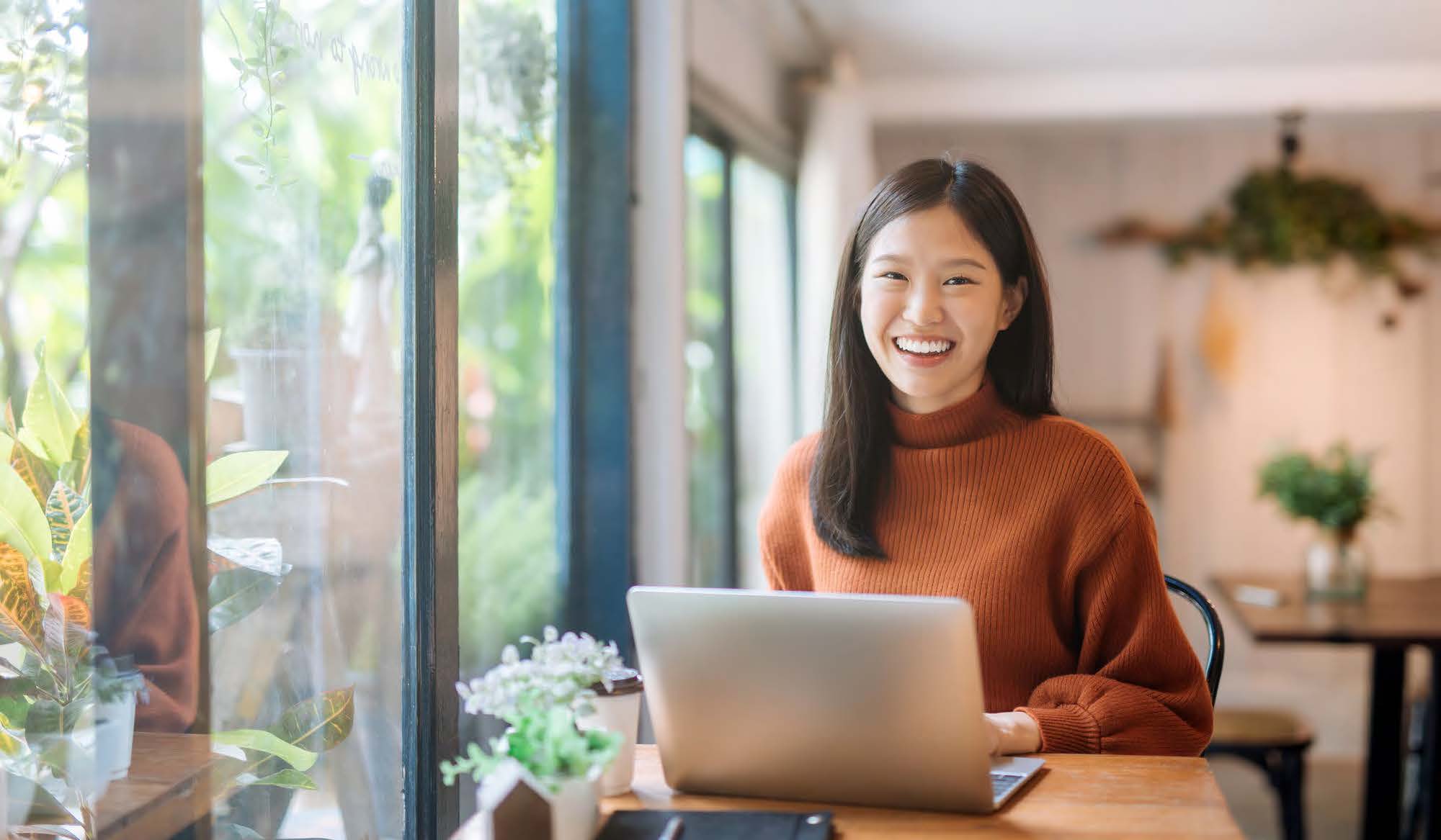 happy woman working on computer